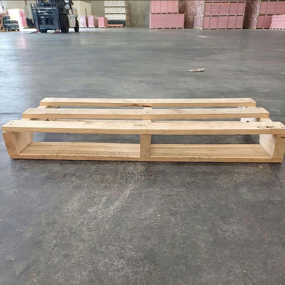 Wooden pallets on a concrete floor in an industrial setting