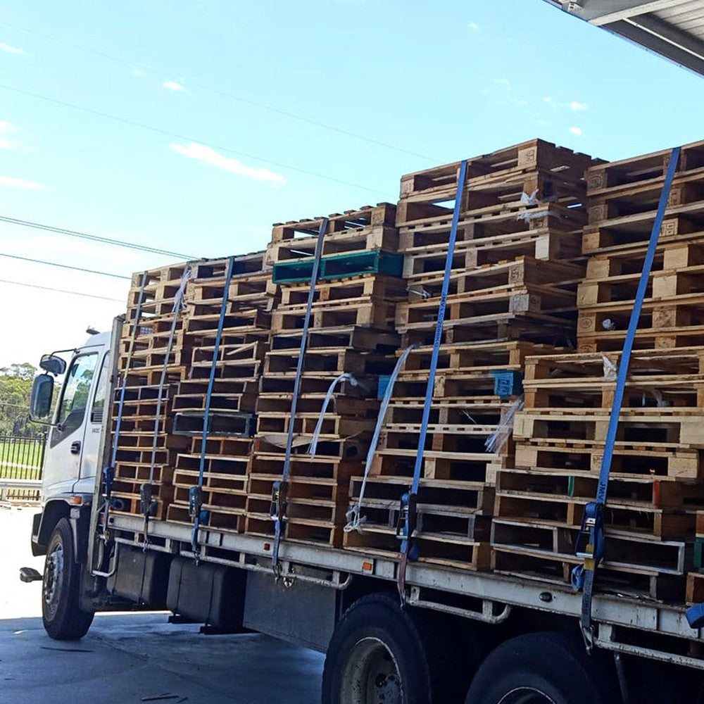 Freight pallets strapped on a truck