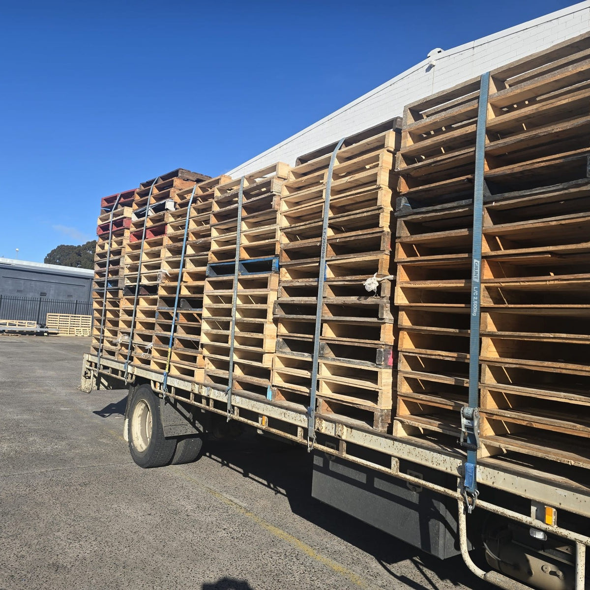 Heavy Duty Australian Standard Pallets strapped on a truck