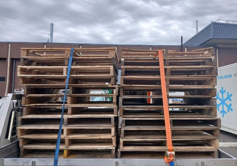 Two straight, strapped stacks of Australian Standard pallets on a ute tray